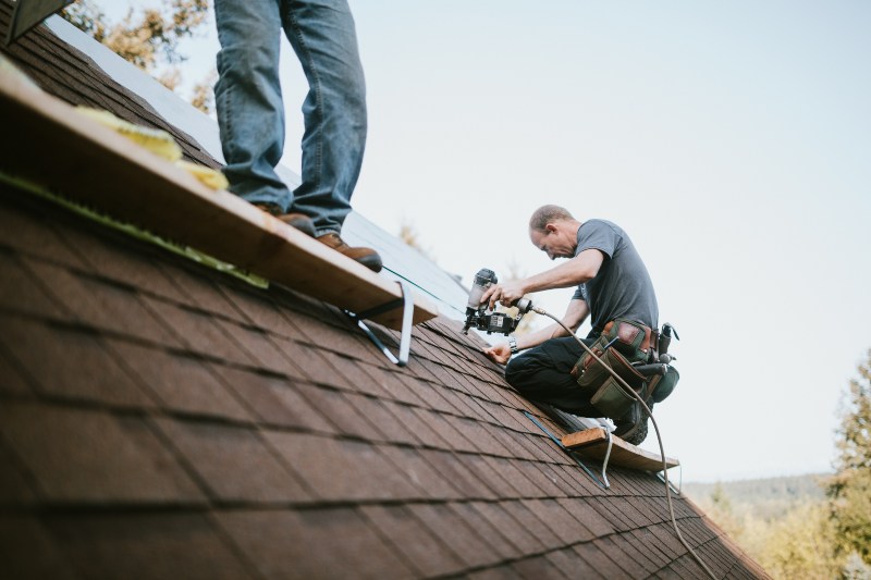 Technician Replacing Roof